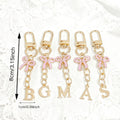 Gold Tone Initial Letter Keychain With Pink Enamel Bow Charm view 4