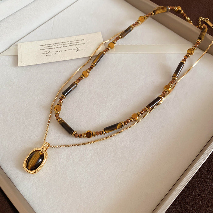 Brown Stone Chip Necklace with Oval Gold Tone Pendant