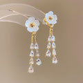 White Flower Crystal Tassel Earrings with Gold Tone Details view 2