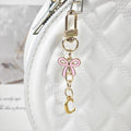Gold Tone Initial Letter Keychain With Pink Enamel Bow Charm view 8