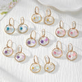 Gold Tone Moon and Butterfly Pressed Flower Huggie Earrings in Eight Designs view 1