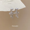 Silver Bow Pearl Fringe Stud Earrings with Polished Metal Details view 3