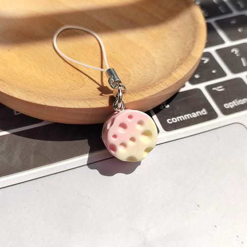 Pink and cream gradient cheese resin phone strap charm close-up