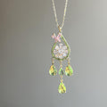 Floral Crystal Teardrop Earrings and Necklace with Polished Metal Details view 4