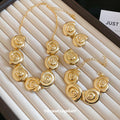 Gold Spiral Shell Necklace Bracelet Earrings and Ring view 3