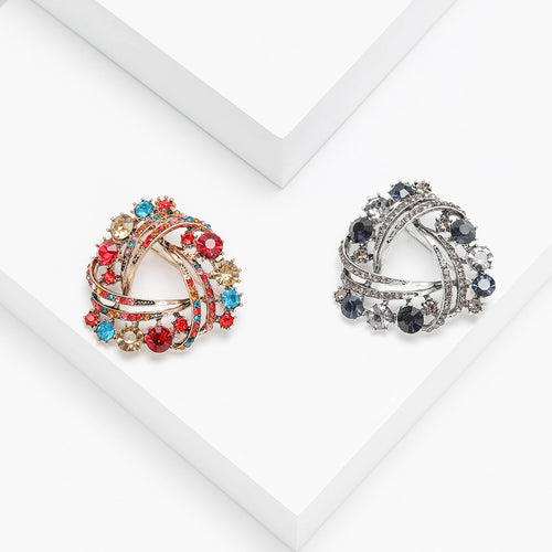 Front view of swirl wreath brooch with multicolor crystal clusters
