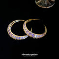 Gold Tone Crescent Hoop Earrings with Purple Crystals view 4