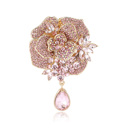 Pink rhinestone peony brooch with clear leaves and teardrop drop