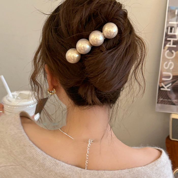 Silver Tone Hair Barrette With Four Large White Pearl Like Spheres