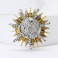 Radiant Sun Brooch In Metal With A Crystal Spiral Center And Mixed-Tone Rays view 1