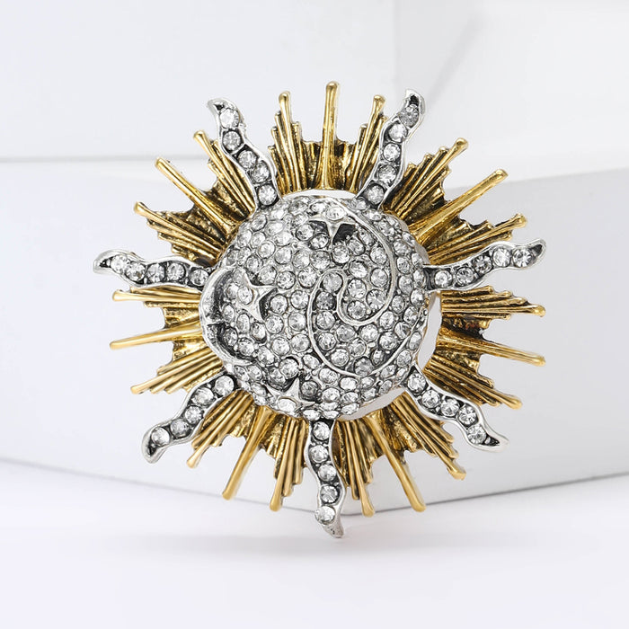 Radiant Sun Brooch In Metal With A Crystal Spiral Center And Mixed-Tone Rays