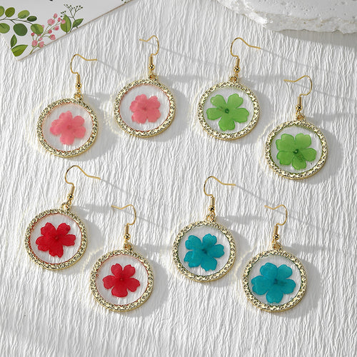 Assortment of gold round frame pressed flower resin earrings in pink red blue green