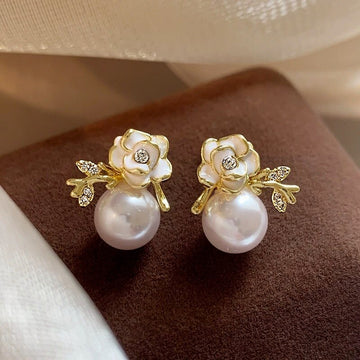 White Flower Pearl Drop Stud Earrings With Gold Tone Leaves
