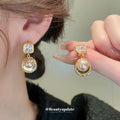 Gold Tone Crystal and Champagne Pearl Drop Earrings view 1