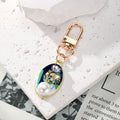 Gold Tone Pearl and Rhinestone Oval Clip Keychains in Six Colors view 2