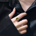 Gold Tone Olive Green Oval Crystal Halo Ring With Clear Stones view 1