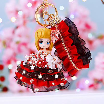 Main image 1 shows a supplied presentation of jeweled dark theme doll keychains with visible attached key hardware.