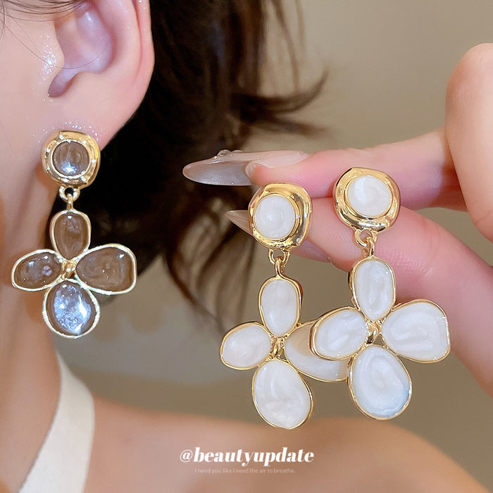 White Four Petal Drop Earrings with Gold Tone Outlines