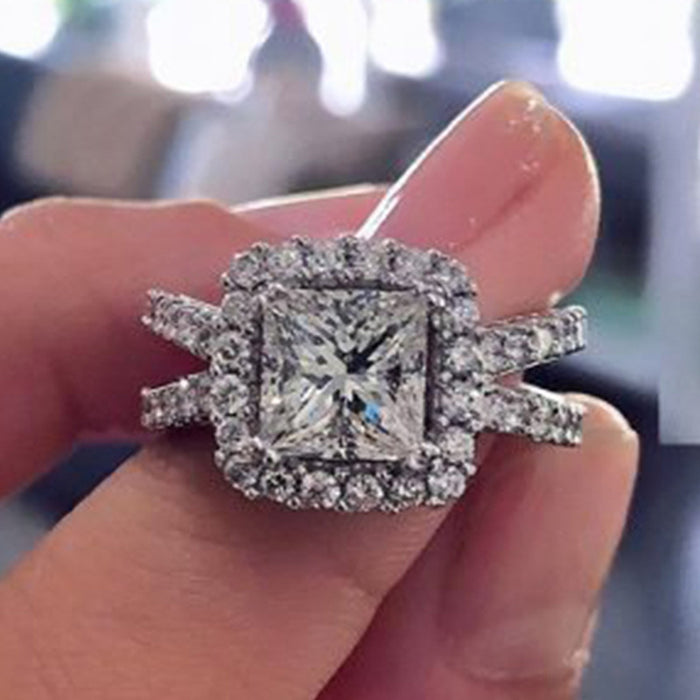 Silver Tone Square Center Stone Halo Ring With Polished Clear Stone Detail