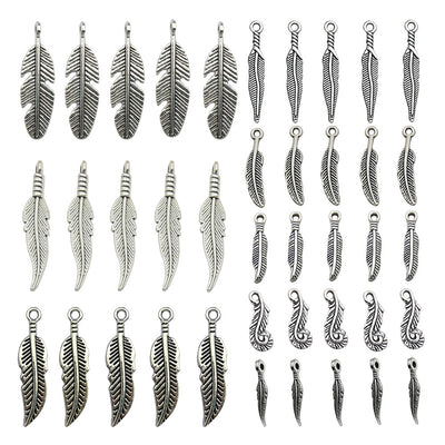 Metallic leaf charms arranged on a light background
