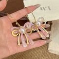 Pink Iridescent Bow Pearl Look Statement Long Hook Earrings view 6