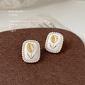 White Enamel Gold Tulip Pearl Frame Stud Earrings Pair view 3