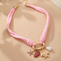 Shell Starfish Turtle And Pearl Charm Necklace In Gold Tone Metal view 4