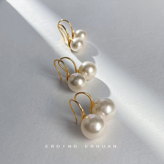 Gold Tone Hook Earrings With White Pearl Drops In Three Sizes