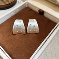 Wide Brushed Hoop Earrings In Gold And Silver Tones view 6