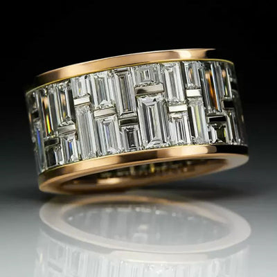 Studio close-up of two-tone baguette grid wide band ring against dark background