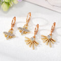 Gold Tone Crystal Bee and Sunburst Huggie Drop Earrings view 1