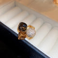 Three Mixed Statement Rings With Brown Crystals Green Or Brown Stones view 6