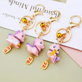 Pink Baby Dragon Keychains in Fortune Tag Ingot and Standing Designs view 4