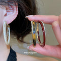 Two Tone Oval Hoop Earrings With Crystal Trim and Colored Inlays view 2