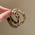 Geometric Hoop Earrings In Six Brown Red And Animal Prints view 4