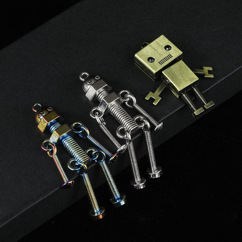 Three metal robot charms: rainbow, silver and antique bronze styles arranged together