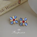 Gold Tone Blue Petal Red Center Flower Earrings In Clip And Stud Styles view 4