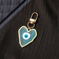 Gold Tone Swirled Heart Evil Eye Clip Keychains in Five Colors view 8