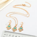 Gold Tone Crystal Hamsa Evil Eye Pendant Necklace and Huggie Earrings view 2