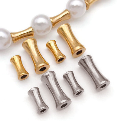 Metallic spacer bead beads arranged on a light background