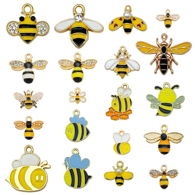 Colorful bee charms arranged on a light background