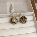 Gold Tone Hoop And Stud Earrings With Marbled Resin Ball Drops view 9