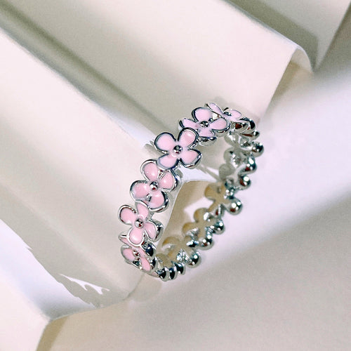 Second product view showing silver-tone pink enamel five-petal flower eternity ring