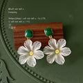 Gold Tone Green Square Stone And Translucent White Flower Earrings view 1
