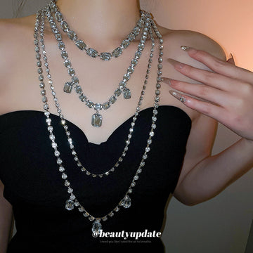 Silver Tone Layered Crystal Necklace with Geometric Drops