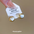 Gold Tone Puffy Heart Stud Earrings with Silver Centers view 2