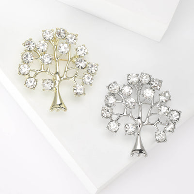 Gold and silver clear rhinestone fortune tree brooches on white