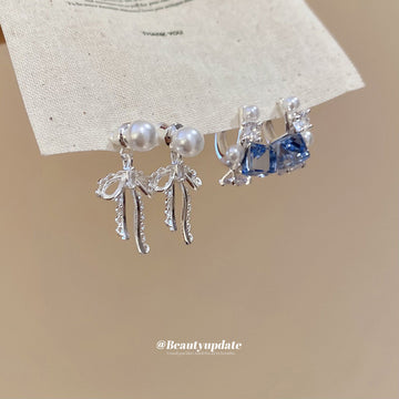 Silver Bow Pearl Fringe Stud Earrings with Polished Metal Details