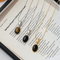 Oval Black Cabochon Pendant Necklace in Gold and Silver Tones view 2