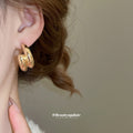 Crossed Triple Hoop Earrings in Gold and Silver Tone view 4